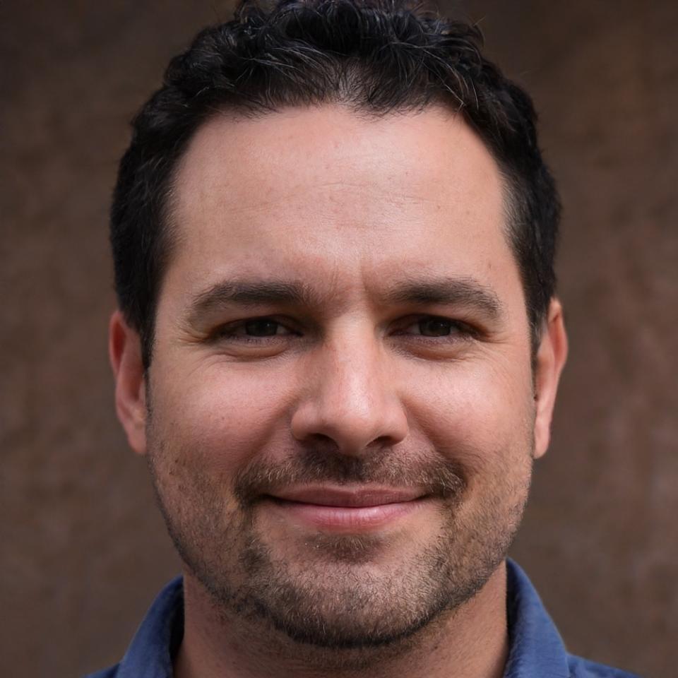 Financial educator Rhys Ashford reviewing course materials